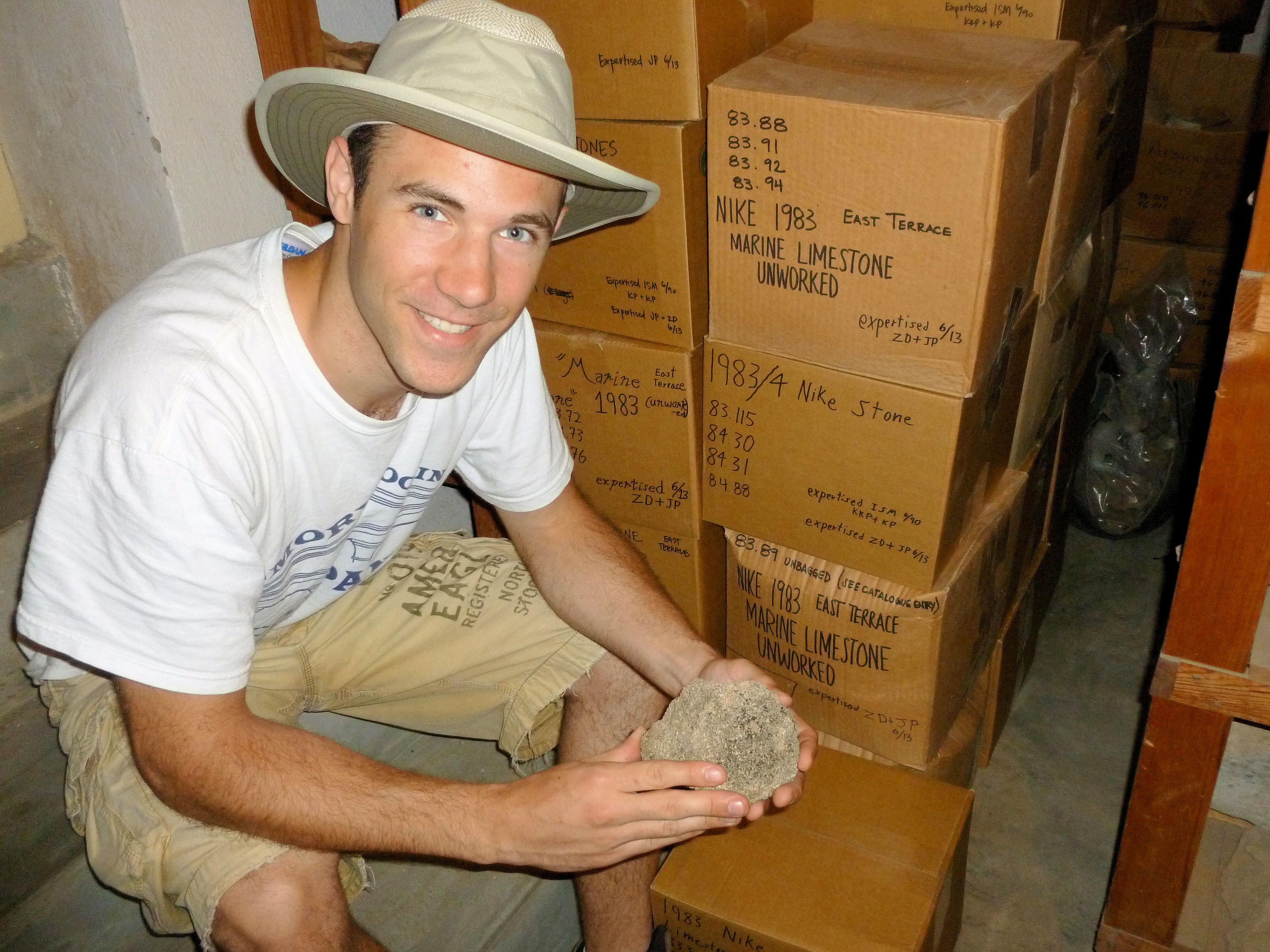 Zach examines an architectural fragment of marine limestone