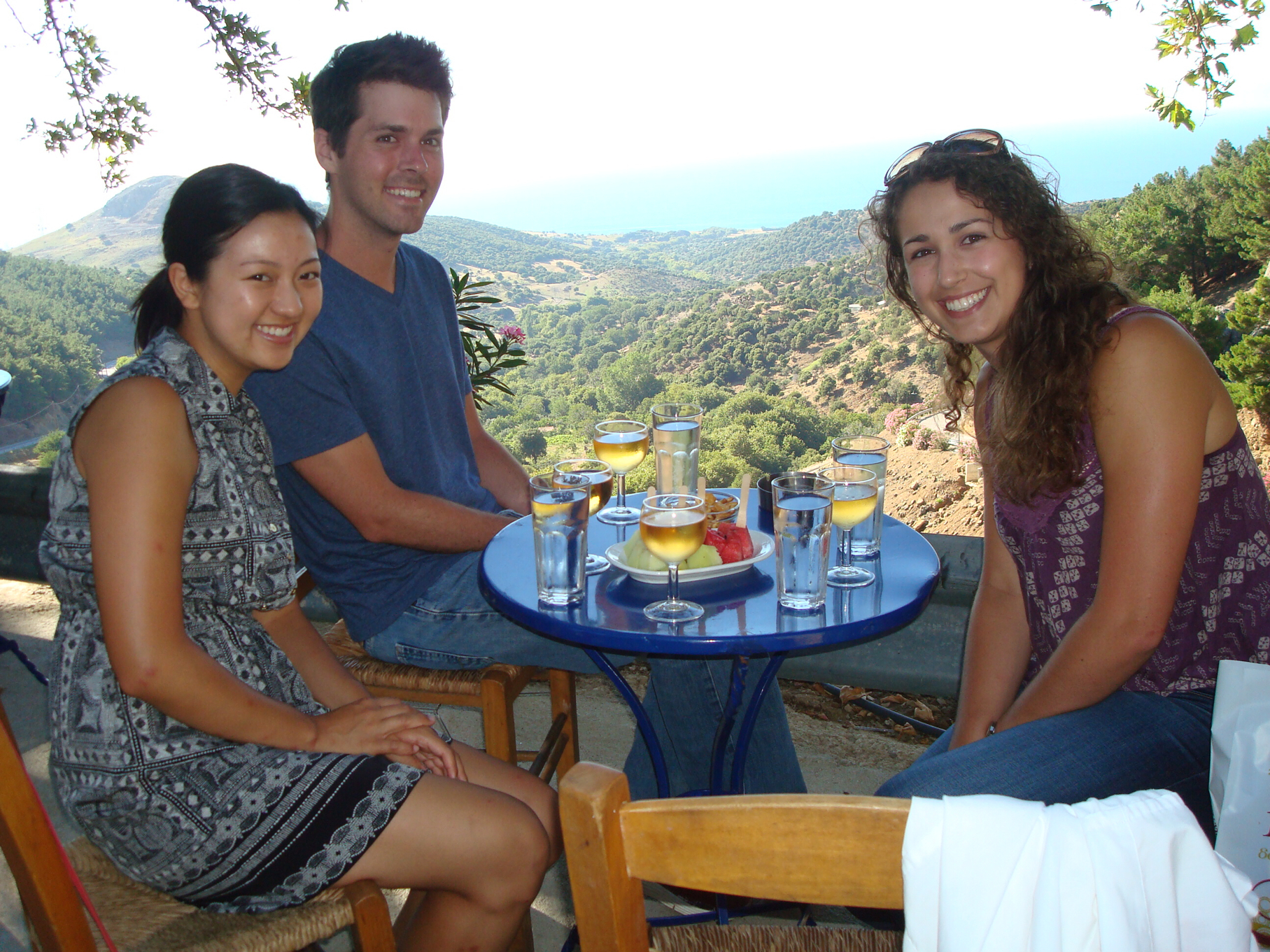 Julianne, Chase, and Hannah enjoying a local taverna in Chora with an unbeatable view.